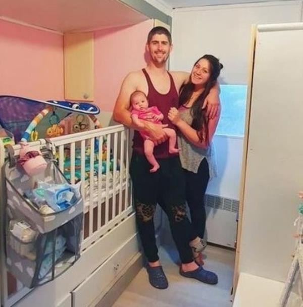 Keyla Remache, 29, with Arwen and 33-year-old husband Liam Millichamp inside their caravan