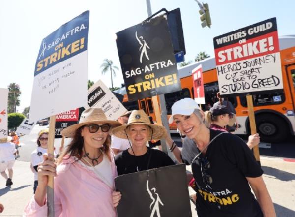 LOS ANGELES - AUGUST 08: (L-R) Michelle Forbes, Tara Buck and Nana Visitor walk the picket line at Paramount Studios on August 08, 2023 in Los Angeles, California. Members of SAG-AFTRA and WGA (Writers Guild of America) have both walked out in their first joint strike against the studios since 1960. The strike has shut down a majority of Hollywood productions with writers in the third mo<em></em>nth of their strike against the Hollywood studios. (Photo by David Livingston/Getty Images)