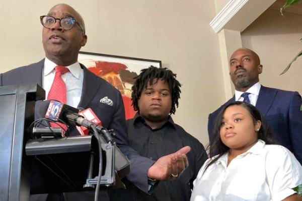 Attorney Roderick Edmond, from left, joined by Treveon Isaiah Taylor, Sr., Jessica Ross and attorney Cory Lynch, speaks during a news conference, Wednesday, Aug. 9, 2023, in Atlanta, announcing a lawsuit against a doctor and Southern Regio<em></em>nal Medical Center, a hospital south of Atlanta wher<em></em>e Ross went on July 9 to have her son. A doctor used too much force and decapitated Ross's baby during delivery according to the lawsuit filed Wednesday, the attorneys said. (AP Photo/Sudhin Thanawala)