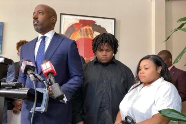 CORRECTS ID AT LEFT TO CORY LYNCH, NOT RODERICK EDMOND - Attorney Cory Lynch, left, joined by Treveon Isaiah Taylor, Sr., Jessica Ross, speaks during a news conference, Wednesday, Aug. 9, 2023, in Atlanta, announcing a lawsuit against a doctor and Southern Regio<em></em>nal Medical Center, a hospital south of Atlanta wher<em></em>e Ross went on July 9 to have her son. A doctor used too much force and decapitated Ross's baby during delivery according to the lawsuit filed Wednesday, the attorneys said. (AP Photo/Sudhin Thanawala)