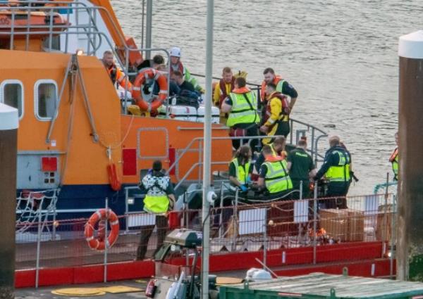 Picture shows : DOVER ENGLAND: 12/08/2023 : The RNLI bring 50 Migrants ashore at Dover Docks this morning that had been rescued mid channel. Border Force and paramedic were there to assist the Migrants trying to reach the UK their was men that need medical attention and taken to hospital.