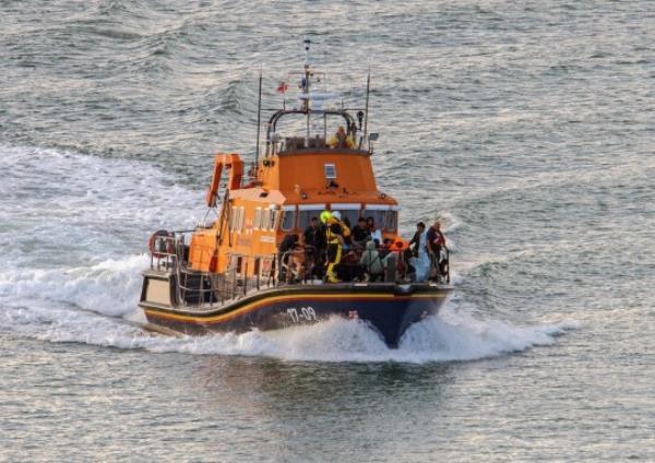 Picture shows : DOVER ENGLAND: 12/08/2023 : The RNLI bring 50 Migrants ashore at Dover Docks this morning that had been rescued mid channel. Border Force and paramedic were there to assist the Migrants trying to reach the UK their was men that need medical attention and taken to hospital.