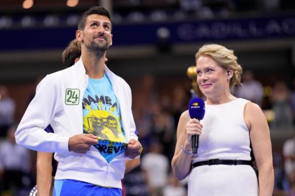 Novak Djokovic, of Serbia, reveals a t-shirt ho<em></em>noring the number 24 and Kobe Bryant after defeating Daniil Medvedev, of Russia, in the men's singles final of the U.S. Open tennis championships, Sunday, Sept. 10, 2023, in New York. (AP Photo/Manu Fernandez)