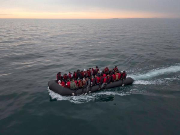 THE ENGLISH CHANNEL, ENGLAND - AUGUST 24: A boat carrying around 50 migrants drifts into English waters after being escorted by a French Warship from the French coastline on August 24, 2023 The English Channel, England. Most of the small boats are collected on the border by UK Border Force vessels and brought into Dover port, after french naval ships accompany them to the border. Another boat then collects the small rubber crafts and loads them to be taken to a UK border Force facility. Over 100,000 migrants have crossed the Channel from France to England on small boats since the UK began publicly recording the arrivals in 2018. (Photo by Dan Kitwood/Getty Images)