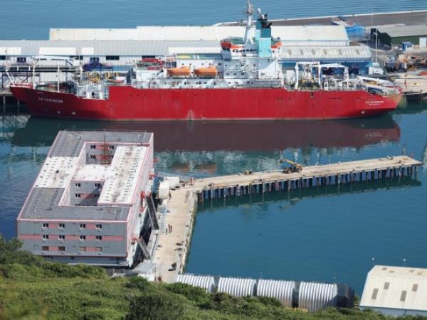 epa10757461 The Bibby Stockholm barge lies in Portland Port in Dorset in Britain, 20 July 2023. The co<em></em>nverted barge will house migrants for up to 18 months. The vessel is over 93 meters long and can house 506 people. Bibby Stockholm is the first vessel secured under Home Secretary Suella Braverman's plans to reduce the cost of asylum accommodation. EPA/NEIL HALL