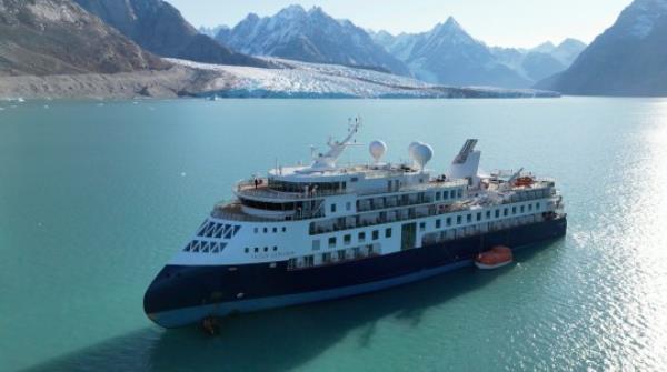 A view of the Ocean Explorer, a Bahamas-flagged Norwegian cruise ship with 206 passengers and crew, which has run aground in northwestern Greenland is pictured on Tuesday, Sept. 12, 2023. The 104.4-meter (343-foot) long and 18-meter (60 foot) wide Ocean Explorer ran aground on Mo<em></em>nday in Alpefjord in the Northeast Greenland Natio<em></em>nal Park. Another attempt to pull free a luxury cruise ship with 206 people that ran aground in the world?s northernmost natio<em></em>nal park has failed by using the high tide. It was the third attempt to free the MV Ocean Explorer. (SIRIUS/Joint Arctic Command via AP)