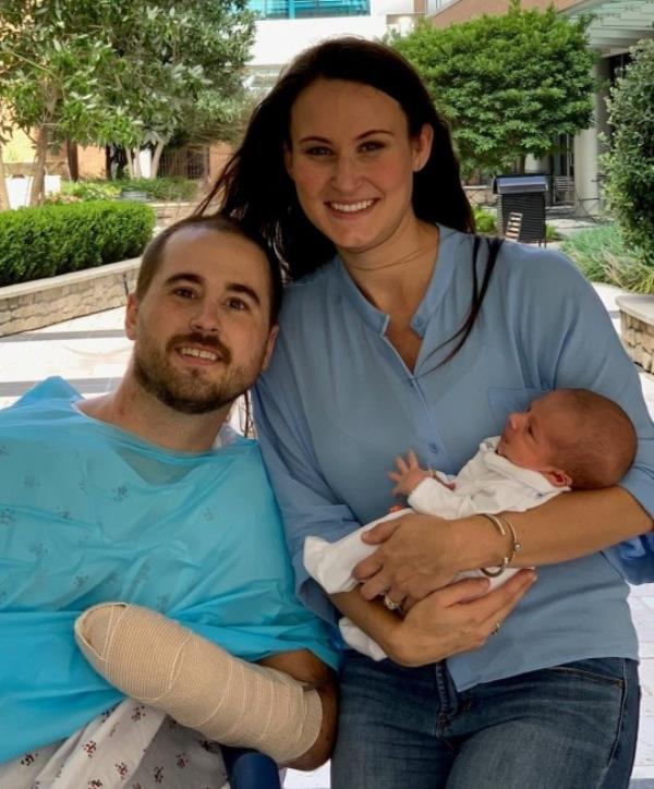 Wells Middleton his wife Lacey, and their youngest son while in hospital. Photo released October 12 2023. See SWNS story SWSMamputation. A dad whose arms were mangled in a work accident now has prosthetic limbs - so he can play with his sons, tie their shoelaces - and hold their hands.Wells Middleton, 33, was working as a welder when a machine trapped both of his arms inside -- and he lost both hands.It crushed them and left him requiring over a mo<em></em>nth in hospital wher<em></em>e he underwent more than ten surgeries to salvage as much of his hands as possible.After missing the birth of his son while in hospital, Wells spent the next three years dealing with the trauma of the accident and learning how to use his prosthetic limbs.