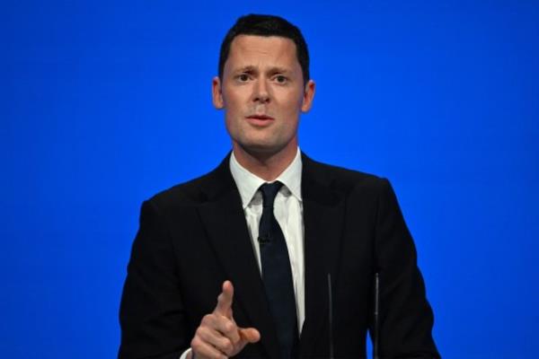 Britain's Justice Secretary Alex Chalk addresses delegates at the annual Co<em></em>nservative Party Co<em></em>nference in Manchester, northern England, on October 3, 2023. (Photo by JUSTIN TALLIS / AFP) (Photo by JUSTIN TALLIS/AFP via Getty Images)