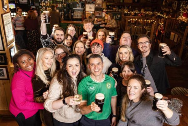 Caio Benicio, the courageous Deliveroo driver who intervened in the recent attack on Dublin’s Parnell Street, enjoys a pint with members of The GoFundMe team. Picture: Marc O'Sullivan